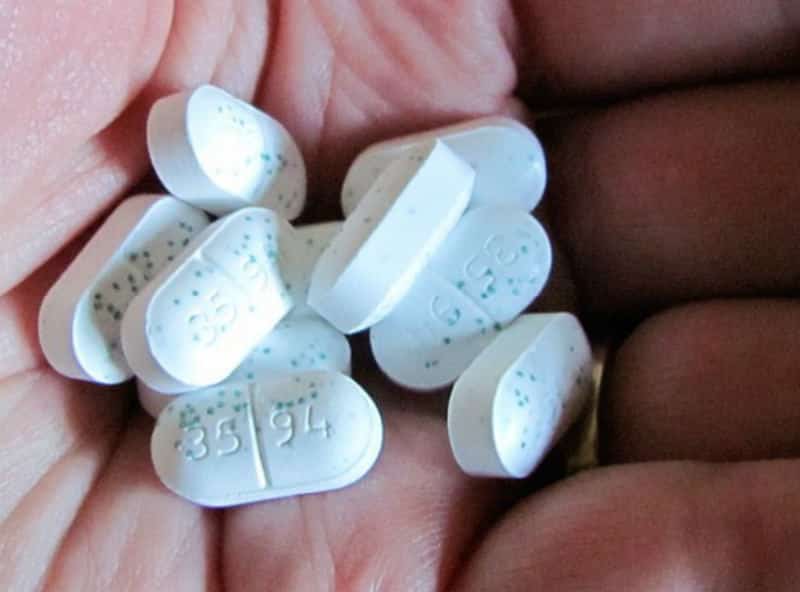 Pills In Man's Hand