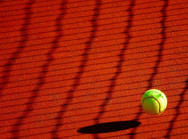 Tennis Ball On Clay Court