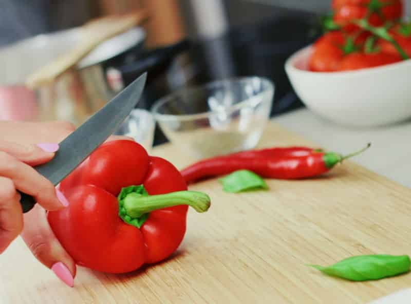 Woman Cuts Bell Pepper
